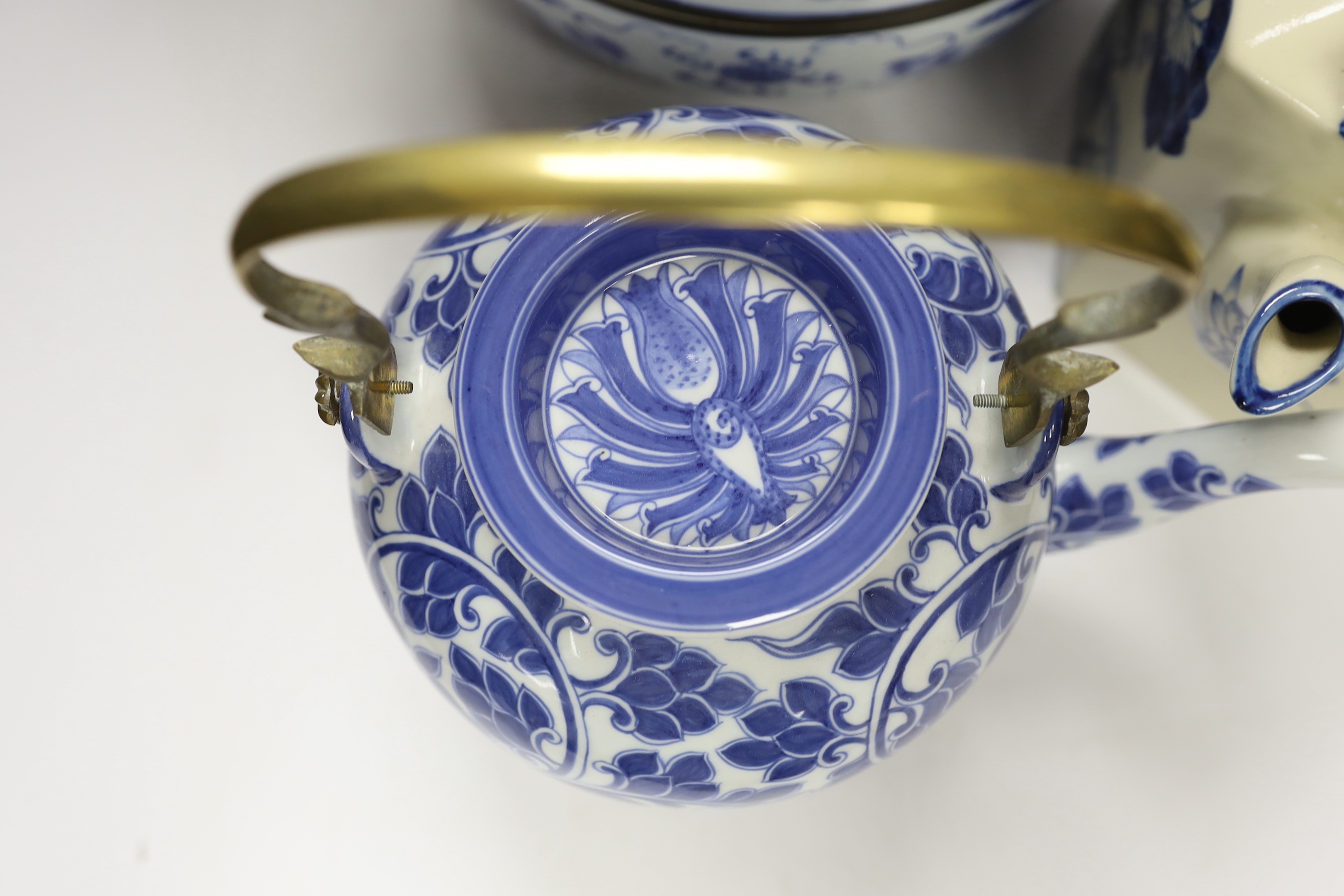 Four modern Chinese blue and white ceramic items; two teapots, a lidded vessel and a bowl, tallest 23.5cm